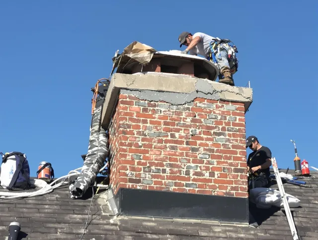 Long Beach Chimney Sweep installing a custom chimney crown in Long Beach, CA